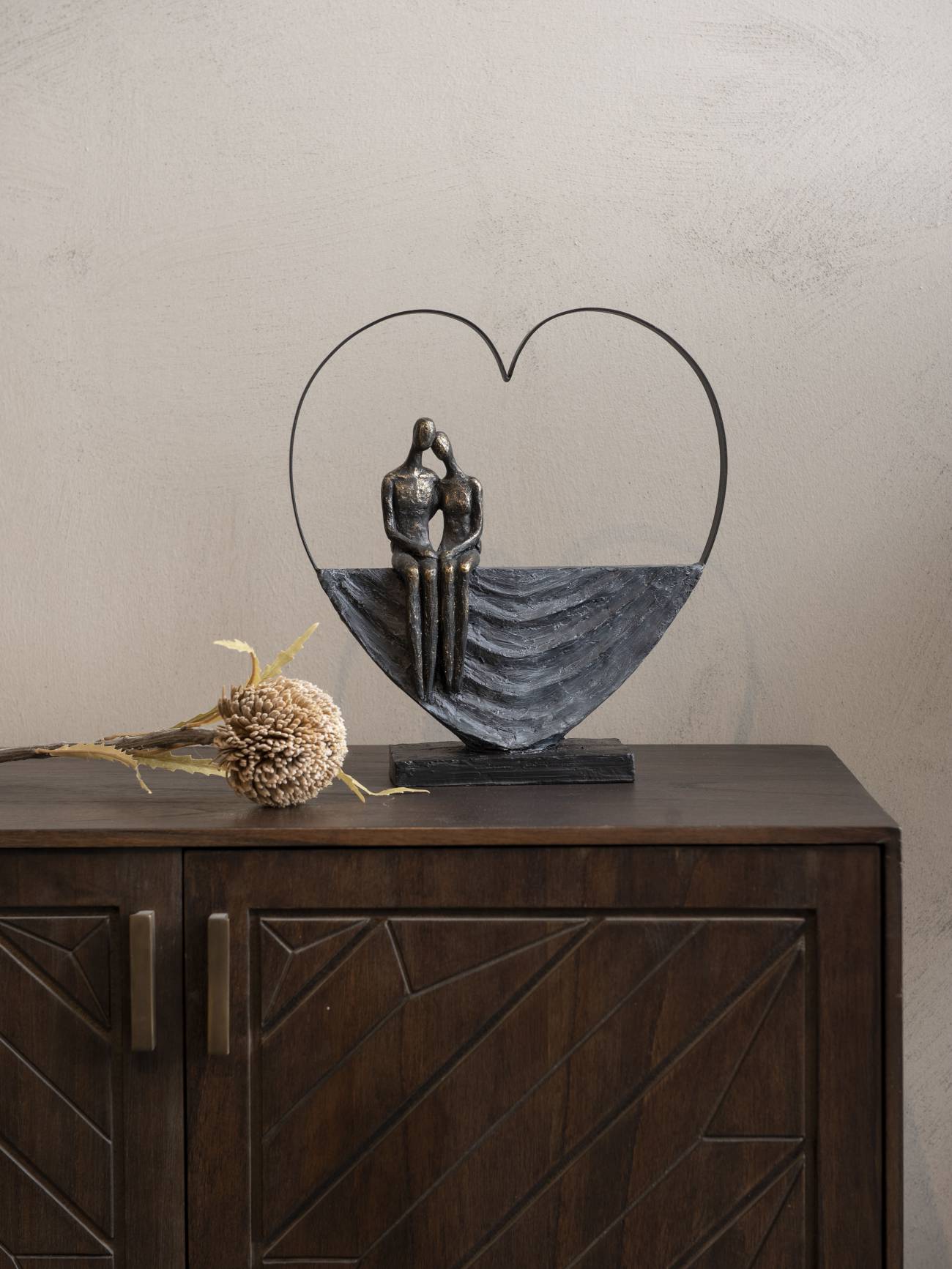 Couple Inside Heart Sculpture